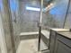 Walk-in shower with built-in seat and grey tile at 3534 Brampton Ln, Westfield, IN 46074