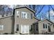 Charming two-story home with white-framed windows and neutral siding with a sunny blue sky at 7934 S 600 W, Edinburgh, IN 46124