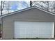 Exterior image of a detached garage featuring a pristine white door at 7934 S 600 W, Edinburgh, IN 46124