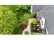 Overhead shot of manicured lawns and gardens surrounding an elegant home at 2838 Silverwood Ln, Greenwood, IN 46143