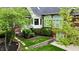 Well-maintained backyard with lush landscaping, including a brick retaining wall and flagstone walkway at 2838 Silverwood Ln, Greenwood, IN 46143
