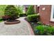 Paver walkway leading to a beautiful home with manicured landscaping and vibrant greenery at 2838 Silverwood Ln, Greenwood, IN 46143