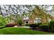Beautiful brick home featuring a well-manicured lawn and professionally designed landscaping at 2838 Silverwood Ln, Greenwood, IN 46143