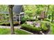 Outdoor patio and sunroom surrounded by lush landscaping, perfect for entertaining or relaxing at 2838 Silverwood Ln, Greenwood, IN 46143