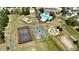 Aerial view of the community's walking trails, tennis and basketball courts, playground, and swimming pool at 882 Brookshire Dr, Franklin, IN 46131