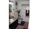 Stylish half bathroom featuring elegant decor and a granite-look vanity at 882 Brookshire Dr, Franklin, IN 46131