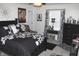 Stylish bedroom with black and white accents, decorative lighting, and coordinated furnishings at 882 Brookshire Dr, Franklin, IN 46131