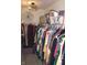 Organized walk-in closet with extensive hanging space, shelving, and luxury handbags on display at 882 Brookshire Dr, Franklin, IN 46131
