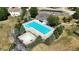 Aerial view of a community pool with a large lap pool and a baby pool, surrounded by lounge chairs and trees at 882 Brookshire Dr, Franklin, IN 46131