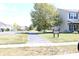 Community trail featuring mature trees, an asphalt path, and manicured lawn at 882 Brookshire Dr, Franklin, IN 46131