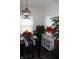 Bright dining room features neutral walls, matching table setting and a modern light fixture at 882 Brookshire Dr, Franklin, IN 46131