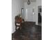 Inviting entryway with dark vinyl flooring, decorative table, and a view of the front door at 882 Brookshire Dr, Franklin, IN 46131