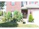 Charming home with colorful flowers and lush green lawn near the entry at 882 Brookshire Dr, Franklin, IN 46131