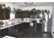 Spacious kitchen with dark cabinets, stainless appliances, and modern countertops at 882 Brookshire Dr, Franklin, IN 46131