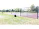 Well maintained tennis court featuring a high net and chainlink enclosure at 882 Brookshire Dr, Franklin, IN 46131