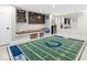 Finished basement with a television and football-themed decor at 1817 Bellefontaine St, Indianapolis, IN 46202