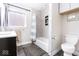 Bathroom featuring a tub with a shower and white walls at 1817 Bellefontaine St, Indianapolis, IN 46202