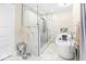 Bathroom featuring a glass-enclosed shower, freestanding tub, and marble tile at 1817 Bellefontaine St, Indianapolis, IN 46202