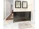 Bathroom featuring a marble double vanity and a view of the hallway at 1817 Bellefontaine St, Indianapolis, IN 46202