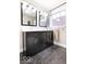 Bathroom featuring a dual sink vanity and large window at 1817 Bellefontaine St, Indianapolis, IN 46202