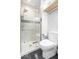 Modern bathroom with a glass-enclosed shower and sleek white tile at 1817 Bellefontaine St, Indianapolis, IN 46202
