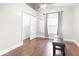 Clean bedroom with hardwood floors, a window for natural light, and ample closet space at 1817 Bellefontaine St, Indianapolis, IN 46202