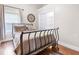 Cozy bedroom with hardwood floors, neutral walls, and a closet at 1817 Bellefontaine St, Indianapolis, IN 46202