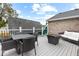 Outdoor deck featuring outdoor seating, a dining table, and a fire pit at 1817 Bellefontaine St, Indianapolis, IN 46202