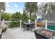 Outdoor deck featuring outdoor seating, a dining table, and a fire pit at 1817 Bellefontaine St, Indianapolis, IN 46202