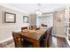 Classic dining room with a large wooden table, decorative lighting, and a view to the backyard at 1817 Bellefontaine St, Indianapolis, IN 46202