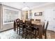 Comfortable dining room features a stylish light fixture, window, and view to the backyard at 1817 Bellefontaine St, Indianapolis, IN 46202