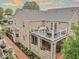 Rear exterior view featuring a brick facade, multiple decks, and professional landscaping at 1817 Bellefontaine St, Indianapolis, IN 46202