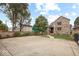 Charming two-story brick home featuring a concrete drive, lush landscaping, and welcoming entryway at 1817 Bellefontaine St, Indianapolis, IN 46202