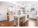 Bright, modern kitchen featuring an island, stylish lighting, and stainless steel appliances at 1817 Bellefontaine St, Indianapolis, IN 46202