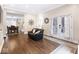 Inviting living room featuring hardwood floors, french doors and an open view to the dining area and kitchen at 1817 Bellefontaine St, Indianapolis, IN 46202