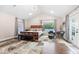 Spacious main bedroom with vaulted ceiling, hardwood floors, seating area, and large windows at 1817 Bellefontaine St, Indianapolis, IN 46202