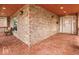 Spacious porch featuring brick flooring, a cozy bench, and classic architecture, offering a warm welcome at 1817 Bellefontaine St, Indianapolis, IN 46202
