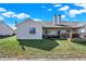 Green backyard features a patio with comfortable seating and a fire pit, ideal for outdoor gatherings at 828 Ashton Park Dr, Greenwood, IN 46143
