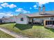 Spacious backyard with a patio, seating area, a fire pit, and a well-maintained lawn at 828 Ashton Park Dr, Greenwood, IN 46143