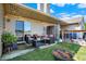 Inviting backyard patio featuring comfortable seating, string lights, and a fire pit at 828 Ashton Park Dr, Greenwood, IN 46143