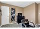 Functional bedroom with decor, a storage cabinet, wall-mounted caps, and neutral-colored walls at 828 Ashton Park Dr, Greenwood, IN 46143