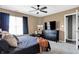 Comfortable bedroom with natural light, ceiling fan, and large dresser at 828 Ashton Park Dr, Greenwood, IN 46143