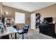 Versatile bedroom with a functional desk, TV, and ample decor, suitable for work or leisure at 828 Ashton Park Dr, Greenwood, IN 46143