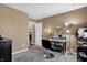 Spacious bedroom featuring neutral walls, makeup vanity, and a glimpse into an adjoining room at 828 Ashton Park Dr, Greenwood, IN 46143