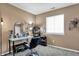 Well-lit bedroom with a makeup vanity, modern lighting, and neutral walls for a clean, stylish look at 828 Ashton Park Dr, Greenwood, IN 46143
