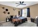 Cozy bedroom with comfortable bed, ceiling fan, and natural light at 828 Ashton Park Dr, Greenwood, IN 46143