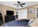 Bedroom featuring large closet, TV, and view into living space at 828 Ashton Park Dr, Greenwood, IN 46143