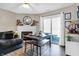Charming dining area with a modern table, stylish decor, and a fireplace, creating a cozy and inviting space for meals at 828 Ashton Park Dr, Greenwood, IN 46143