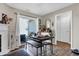 Bright dining area with a rustic table, modern decor, and sliding glass doors, creating an inviting space for meals at 828 Ashton Park Dr, Greenwood, IN 46143