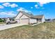 Charming ranch-style home featuring a two-car garage, well-manicured lawn, and inviting curb appeal set under a sunny sky at 828 Ashton Park Dr, Greenwood, IN 46143